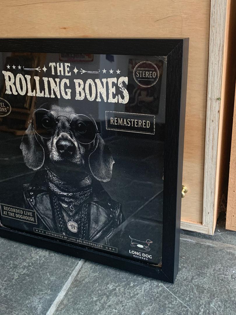 Framed album cover with a dog wearing sunglasses and a bandana, titled 'The Rolling Bones'.