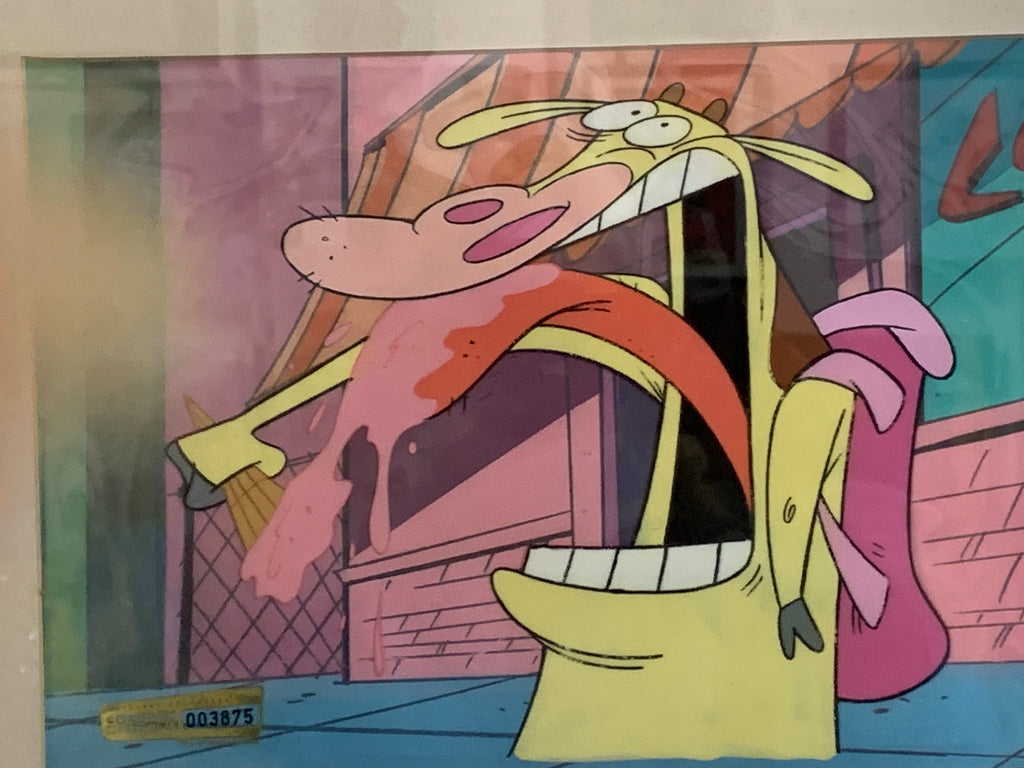 A printed or painted cartoon scene featuring a The Cow and Chicken with a long tongue sticking out, surrounded by pink, purple, orange, and blue background elements. No visible brand text is present.