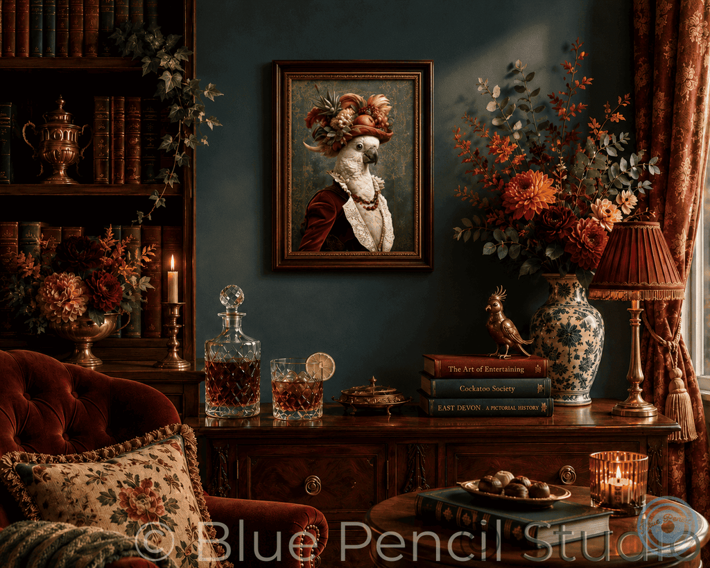 A framed portrait painting of a cockatoo hangs on a dark blue wall in a richly decorated room. The scene includes a red velvet armchair, a wooden console table with books, a decanter, a lamp, and a large floral arrangement in a blue-and-white vase.